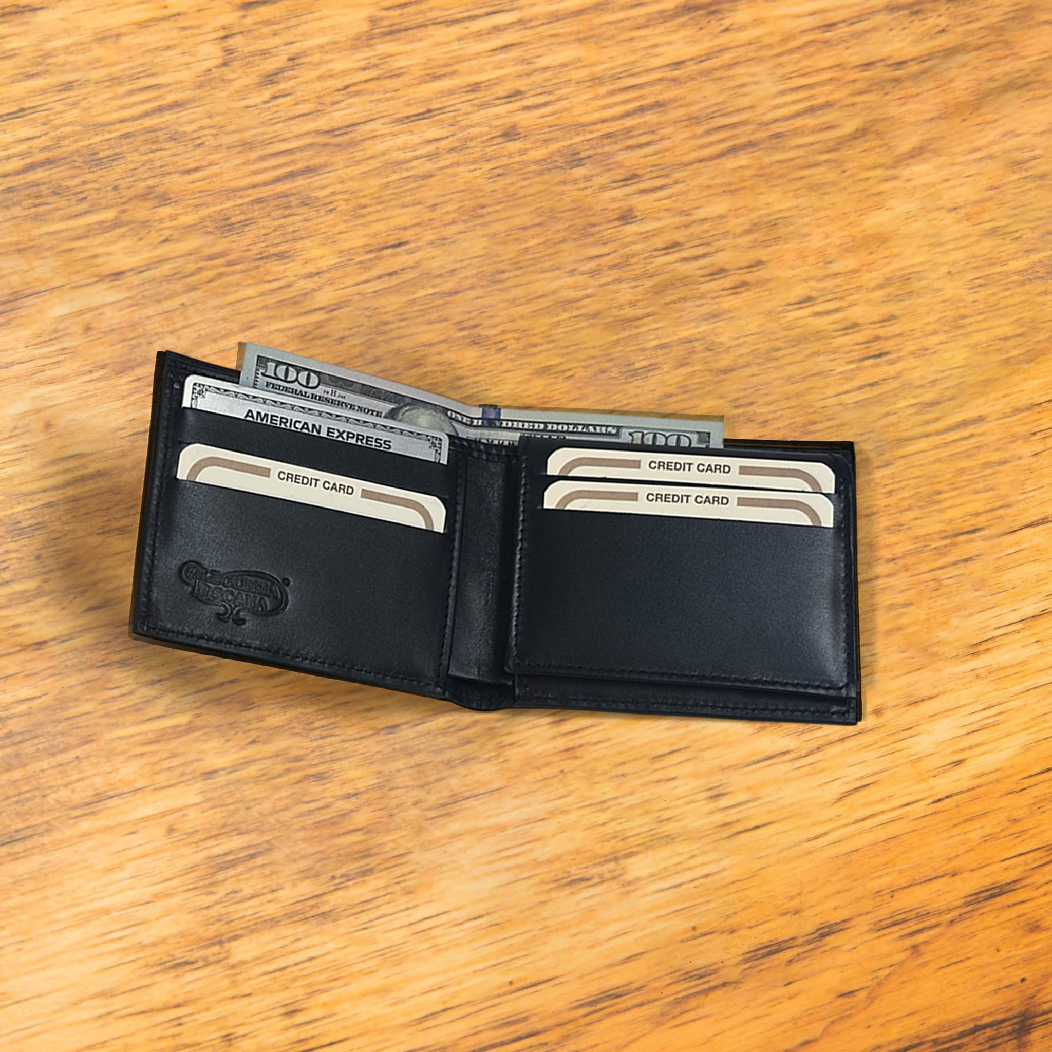 Black opened wallet  with credit cards and some cash in it  at wooden surface