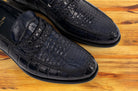 A Pair of Blue leather loafer on a wooden surface
