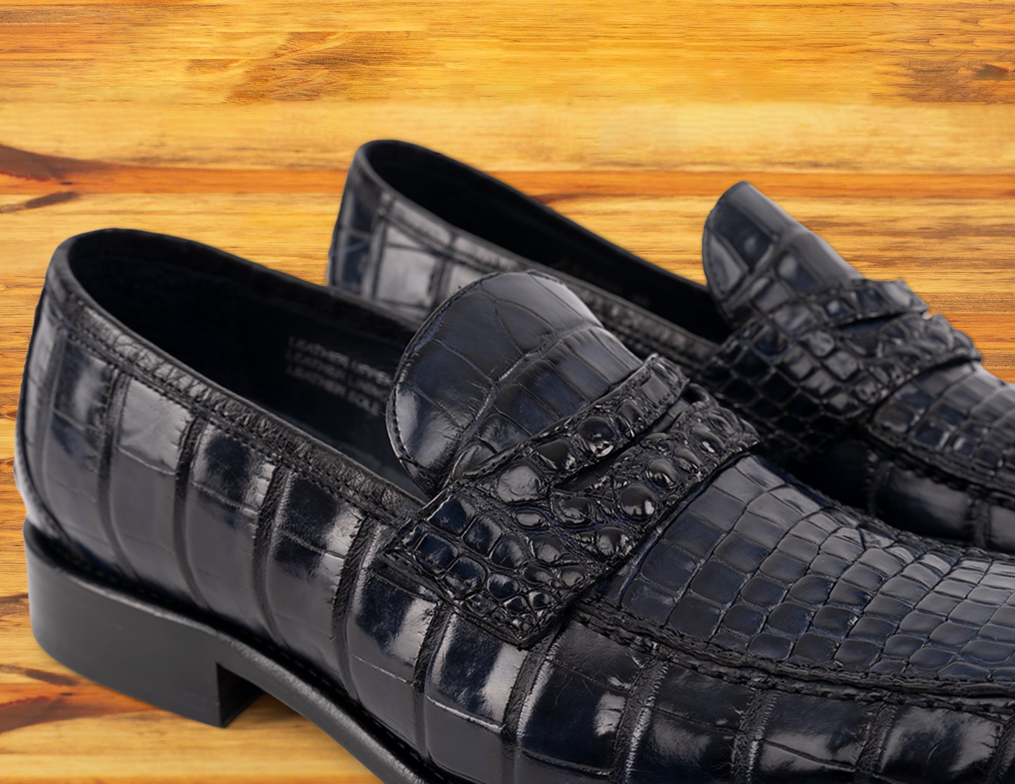 A Pair of Blue leather loafer on a wooden surface