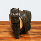 Olive Green Hornback Belt on top of a wooden table