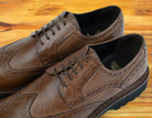 A Pair of Cerris leather shoe on a wooden surface