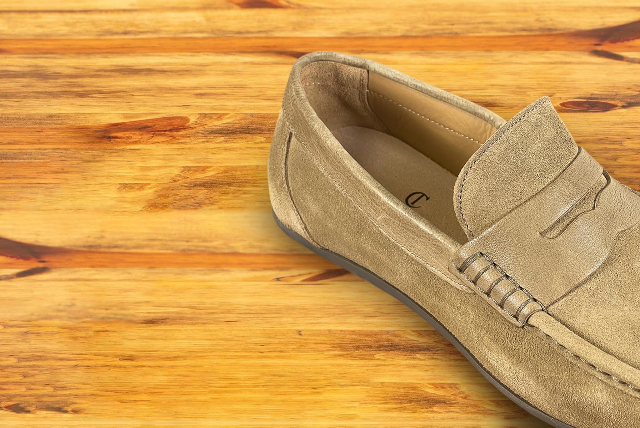 Rope color loafer shoe on a wooden surface