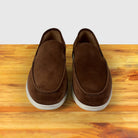 A Brick Pair of Loafers on top of a wooden surface
