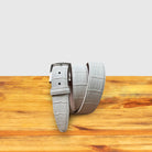 C8099  White Calzoleria Toscana Crocodile Belt on a wooden surface