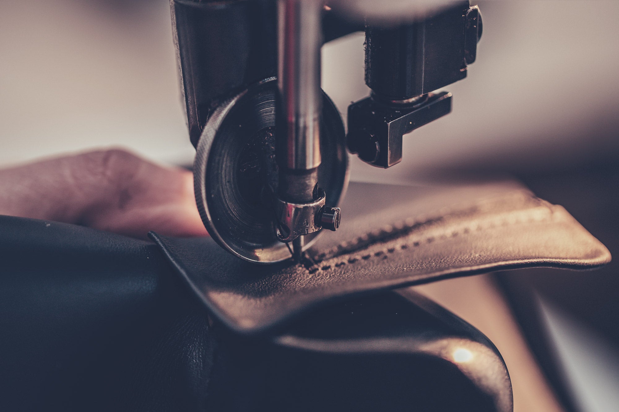 Tan leather dress shoes on wooden lasts at the Calzoleria Toscana workshop in Italy — handcrafted shoe construction process