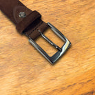 Brick belt buckle on a wooden surface