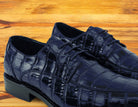 Pair of Blue crocodile shoe on a wooden surface