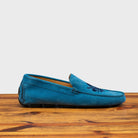 Denim loafer with embroidery on a wooden surface