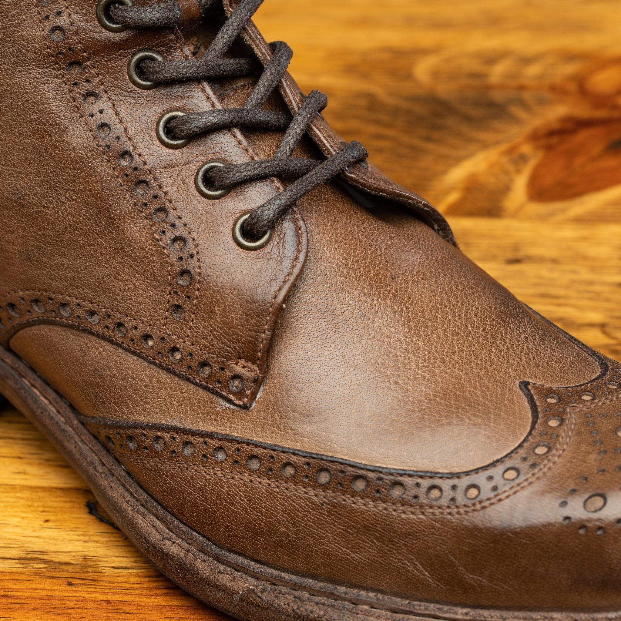 Moor leather boots on a wooden surface