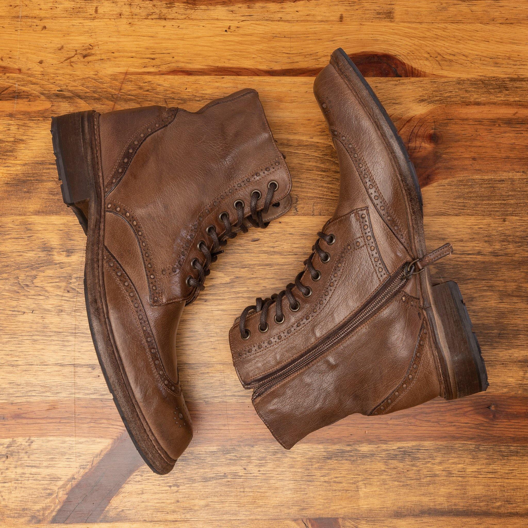Side view of Moor leather boots on a wooden surface