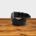 Dark Brown textured belt with a silver buckle on a wooden surface