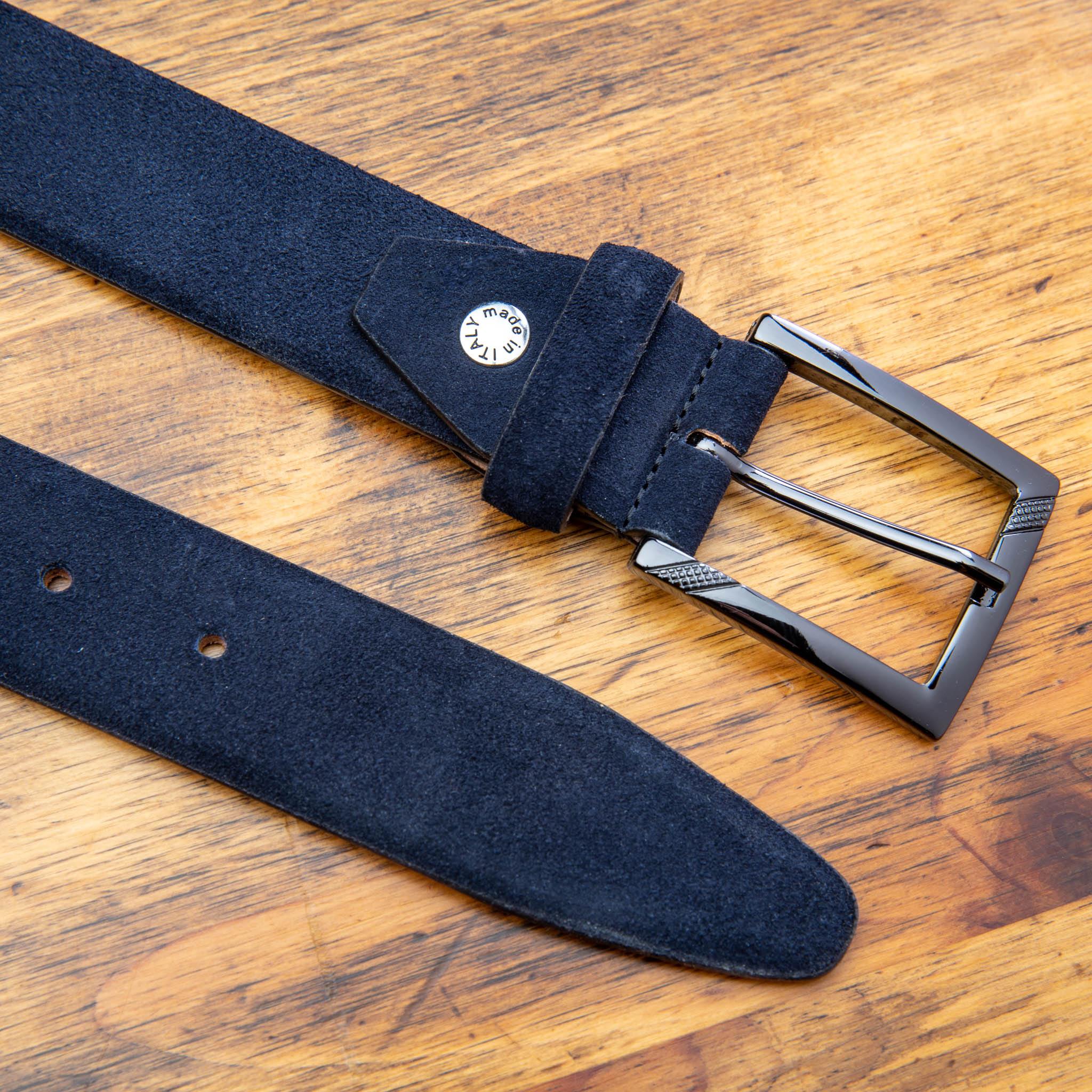 Blue belt with a silver buckle on a wooden surface