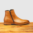 Chester leather ankle boot with zipper on a wooden surface