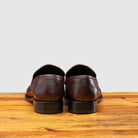 Porpora leather loafer on a wooden surface with a light gray background