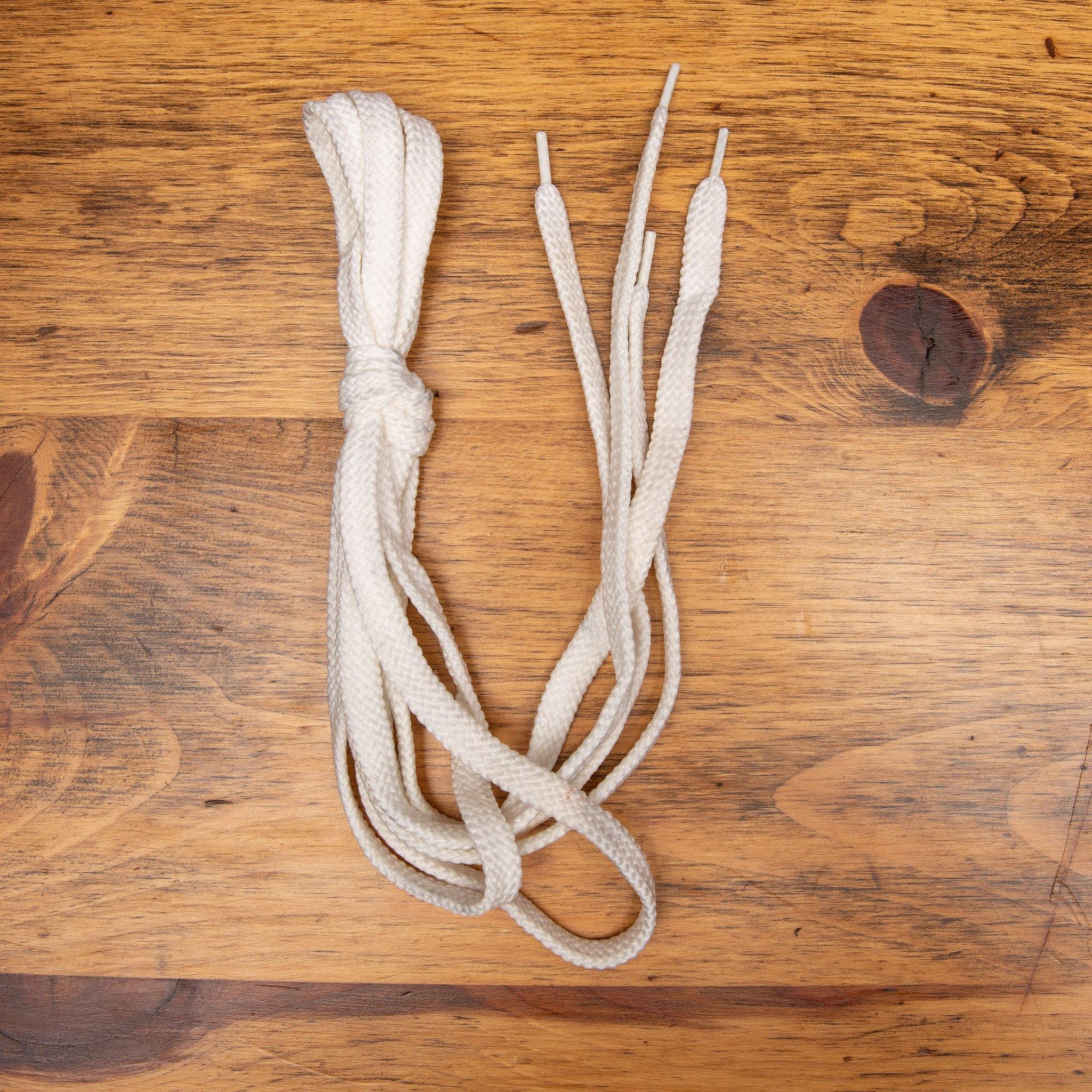 White shoelaces on a wooden surface