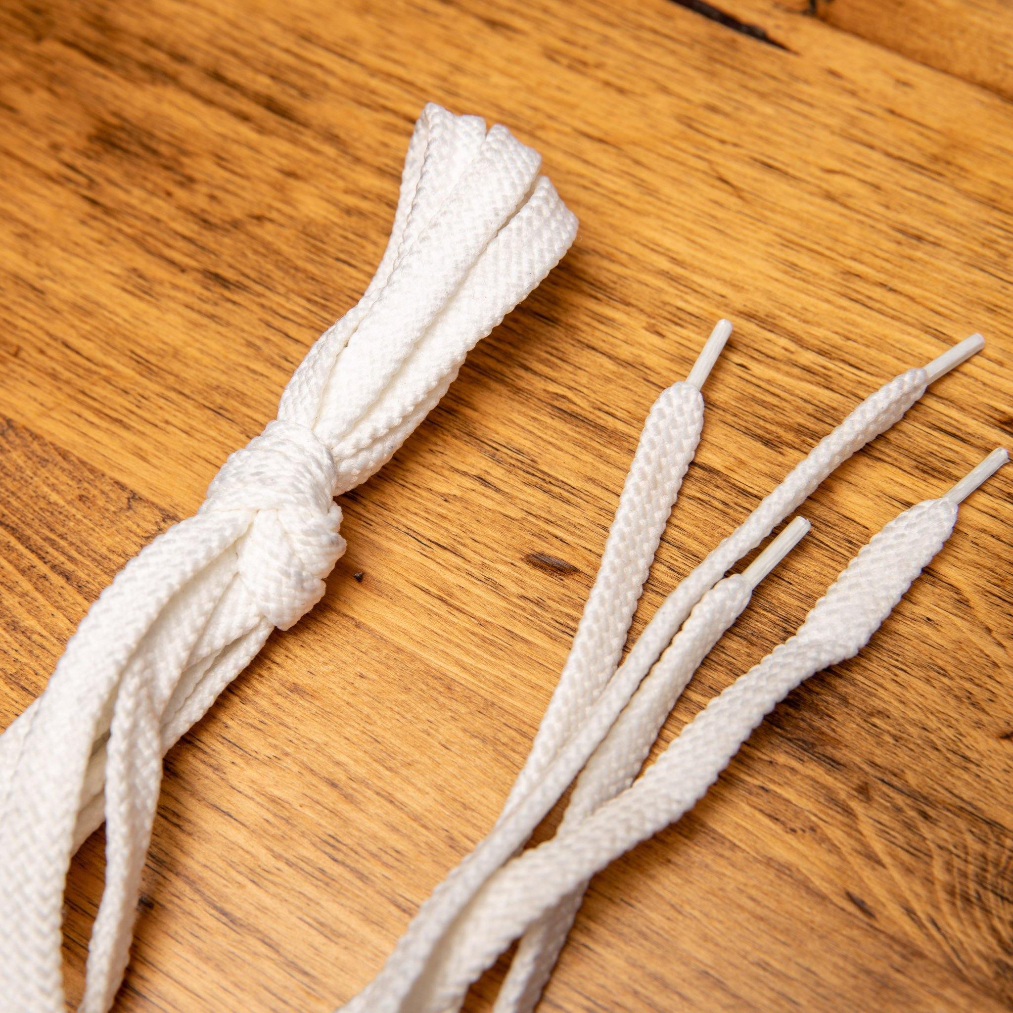 White shoelaces on a wooden surface