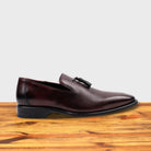 Porpora leather loafer with a tassel on a wooden surface